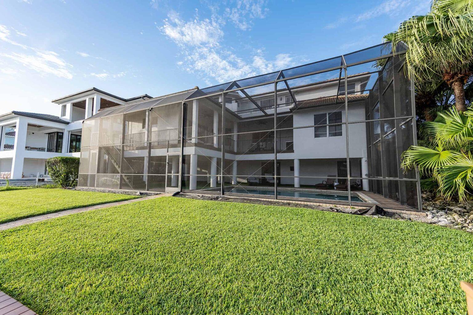 naples fl vacation home Backyard looking at screened-in lanai. backyard screened in pool